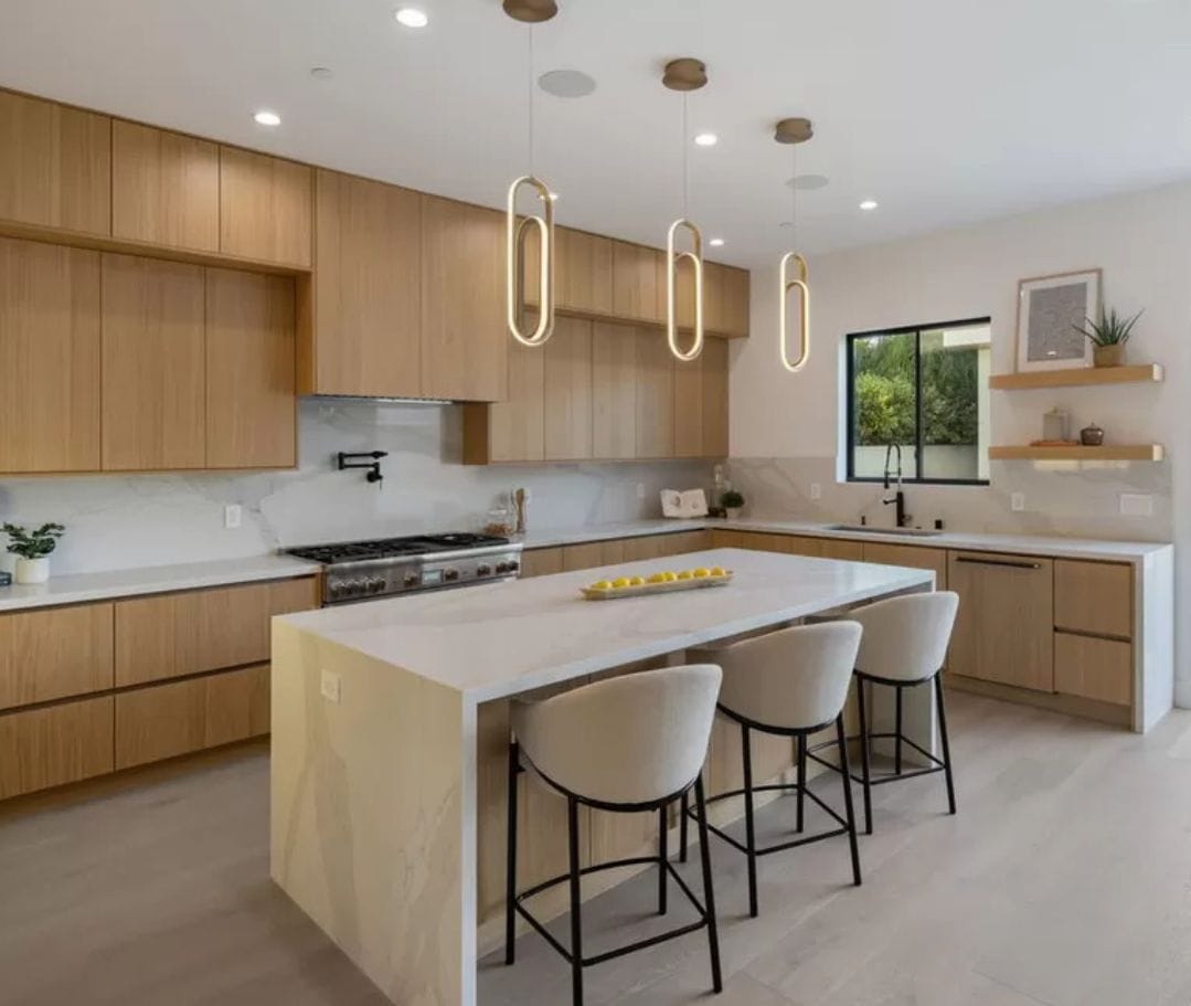 Kitchen with wood cabinets and table island