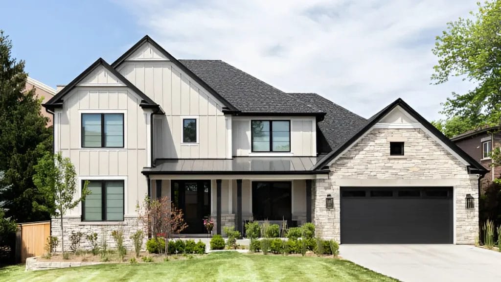 A photo of a modern, contemporary home with a flat roof and bold geometric shapes. The house has large glass windows and is made of sustainable materials