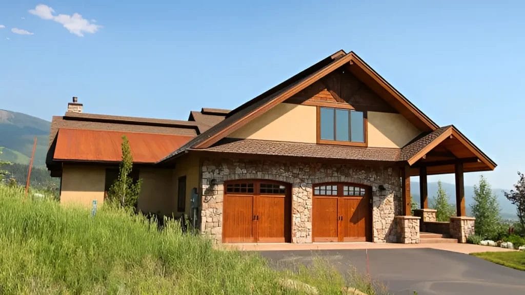 A photo of a rustic mountain home with a wooden exterior and stone accents